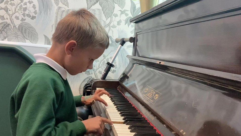 Anastasiia Medolyz's son playing piano