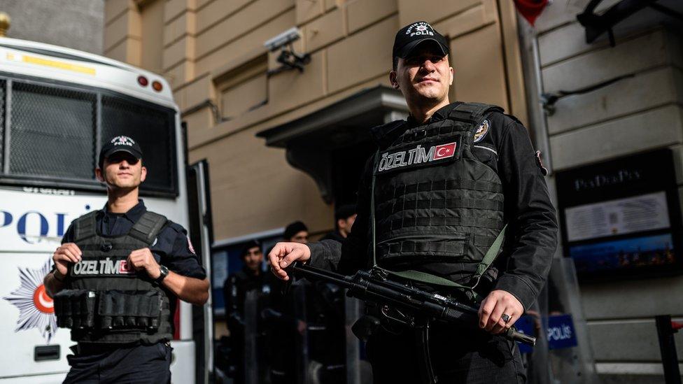 Turkish riot police stand guard in front of the Russian consulate in Istanbul during a demonstration against Russia's policies towards Syria on November 24, 2015.