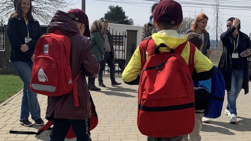 Children with backpacks in Romania