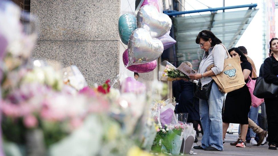 Flowers are left at the scene near to where Elianne Andam was killed