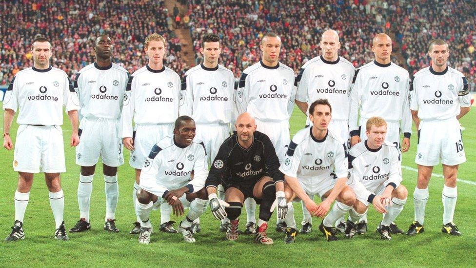 Prankster Karl Power manages to get into a Manchester United team photo.