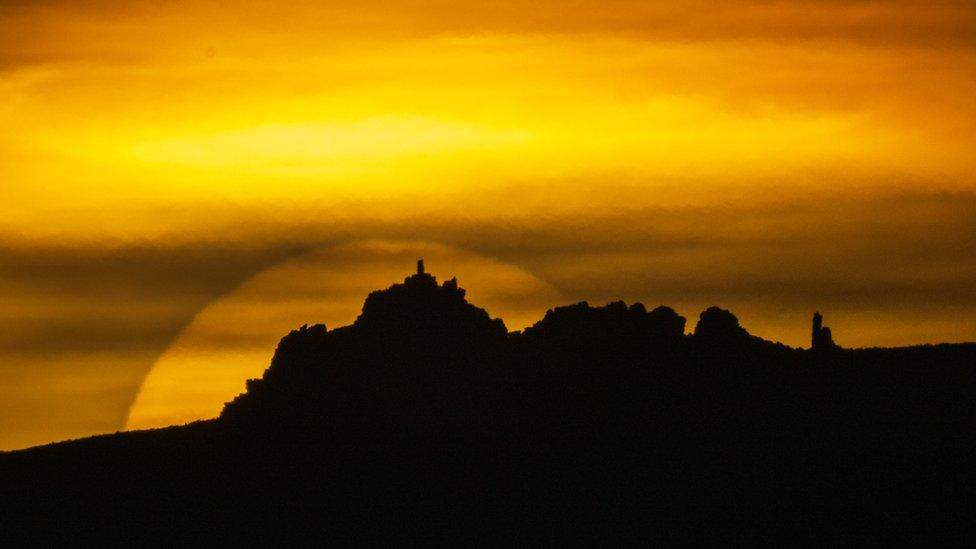 Sun setting behind Manstone Rock