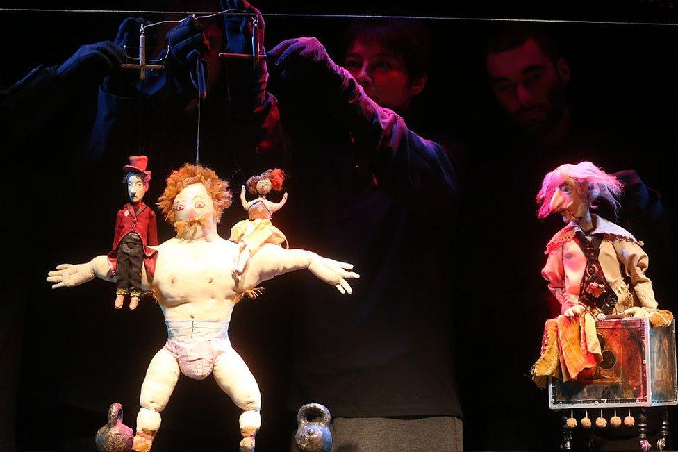 A scene from the Ramona production of Georgian theatre and film director, playwright, writer, painter and sculptor Revaz "Rezo" Gabriadze's puppet theatre at a multimedia exhibition of Gabriadze's works at the Museum of Moscow.