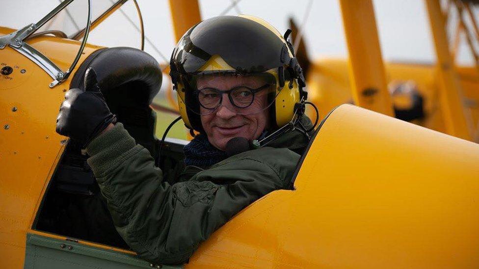 A pilot in a Tiger Moth