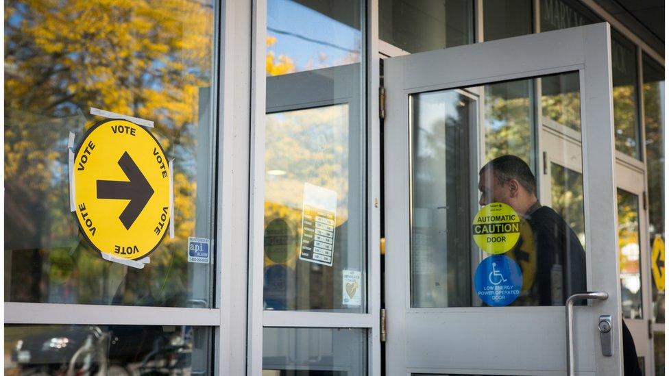 Voters make their way in and out of the polling station at the Mary McCormick Recreation Centre, in Toronto's Davenport riding, during the October 2015 general election