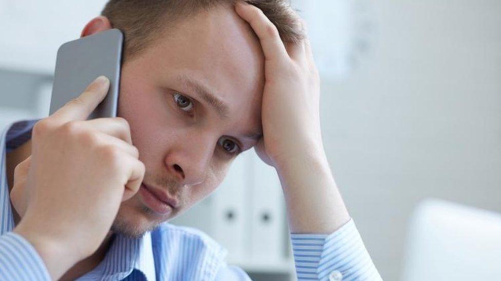 Man frustrated on smartphone