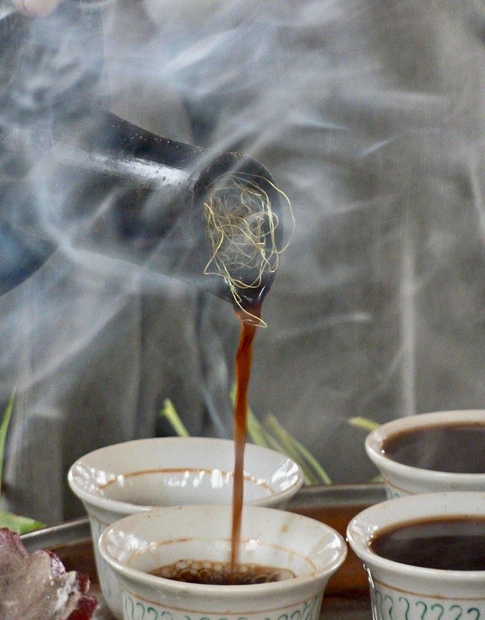 Coffee poured out of a mesh