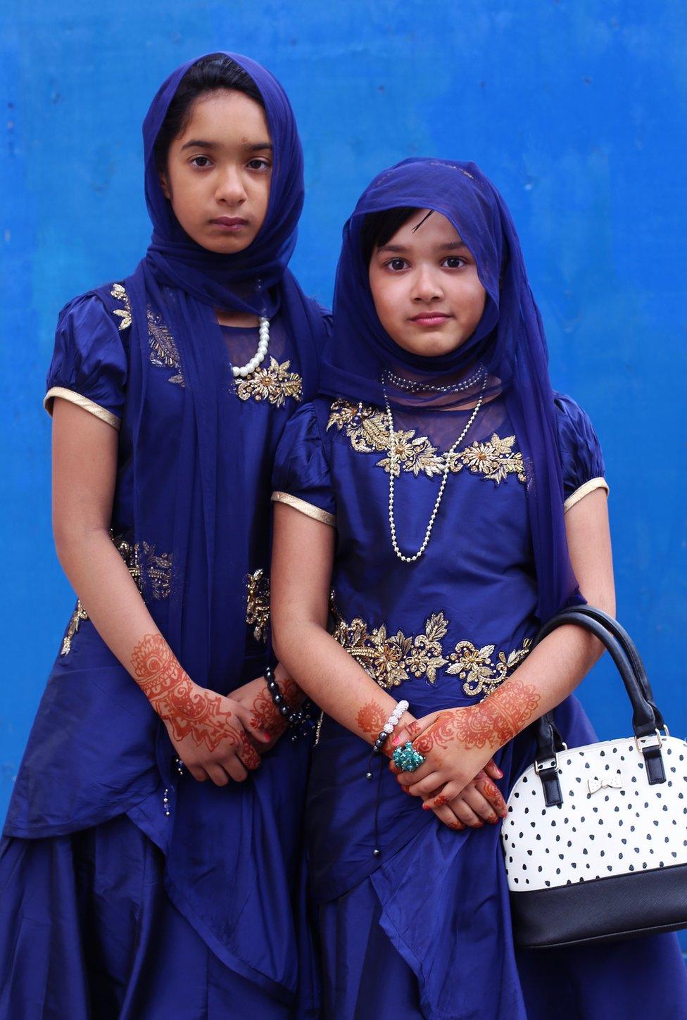 A pair of young girls in religious dress.