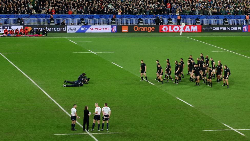 Jacob with the match officials during New Zealand's haka