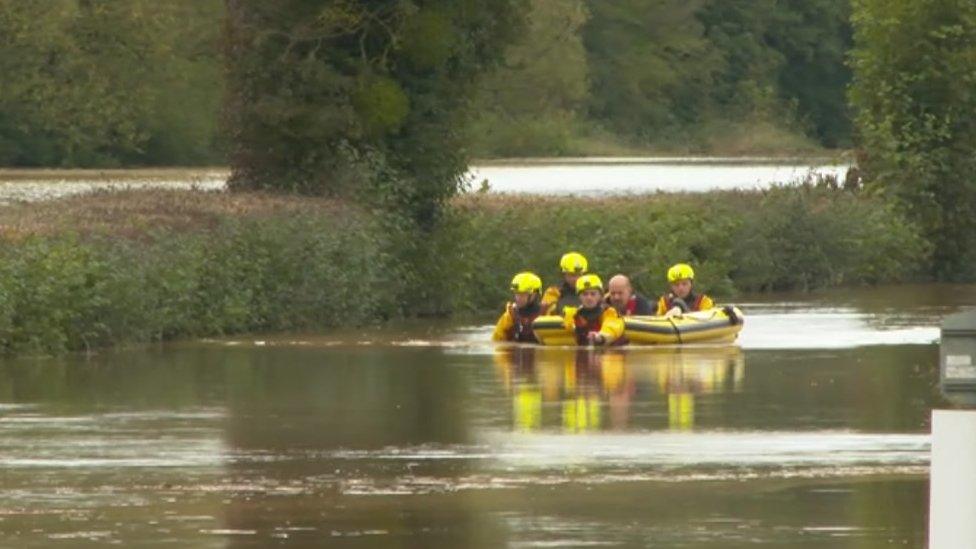 Man being rescued in floods