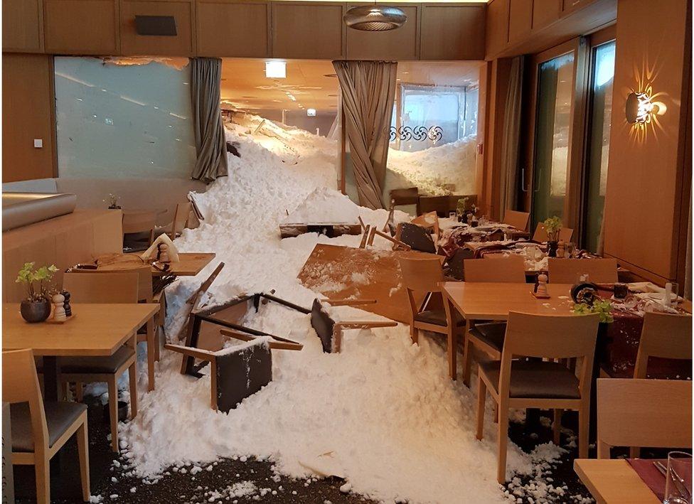 The snow is seen at the Säntis hotel after an avalanche hit it in Schwägalp, Switzerland