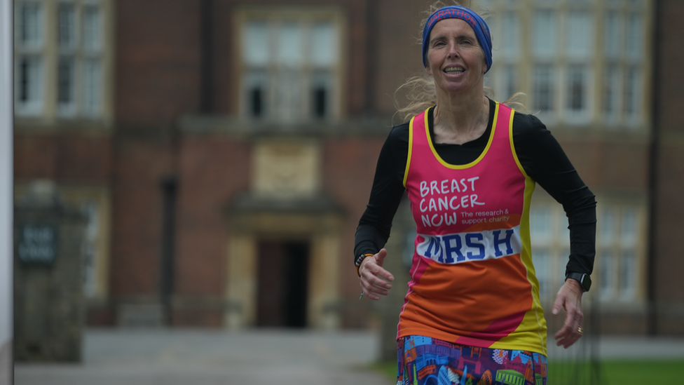 Apryl Hammett in running vest outside school