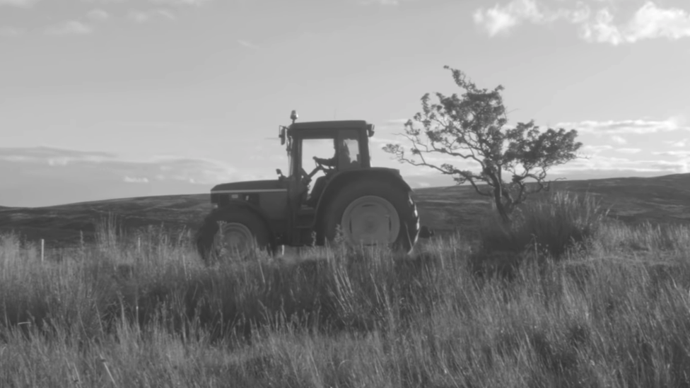 Phoebe Bridgers drives a tractor