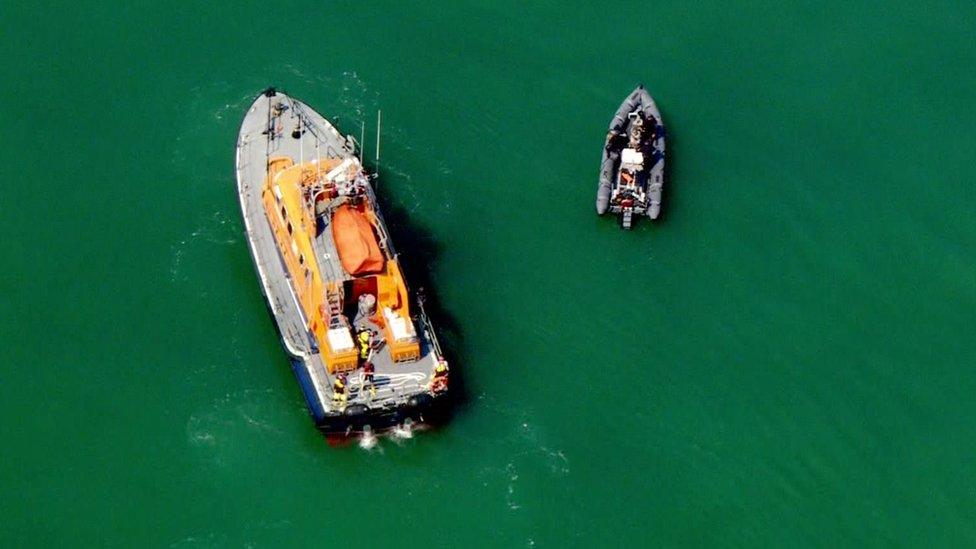 An RNLI lifeboat and a dinghy