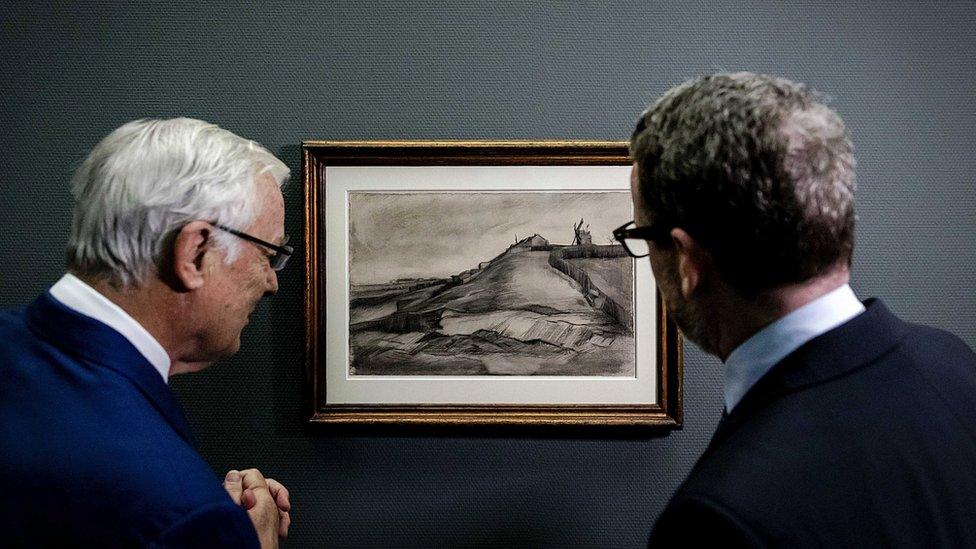 Two men looking at recently discovered Van Gogh sketch