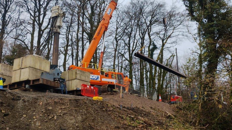 Orange crane and the embankment works