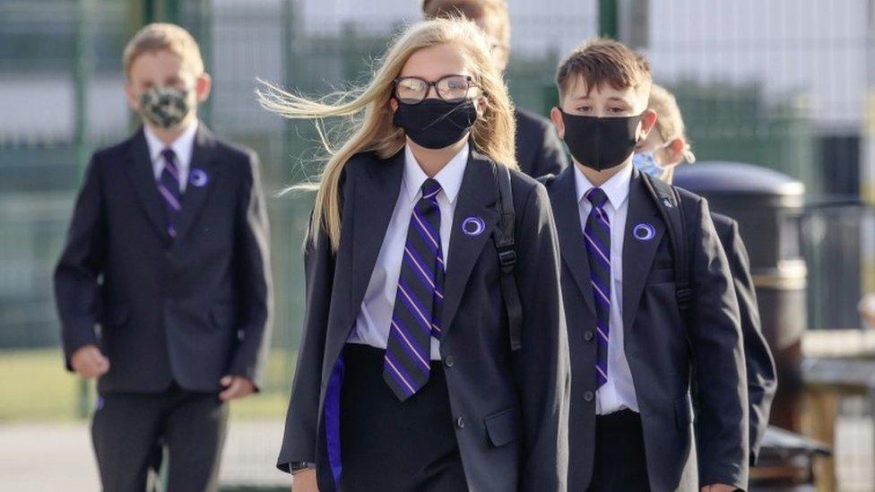 Schoolchildren wearing masks