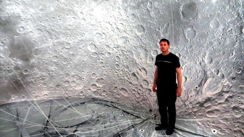 Artist Luke Jerram inside the moon balloon