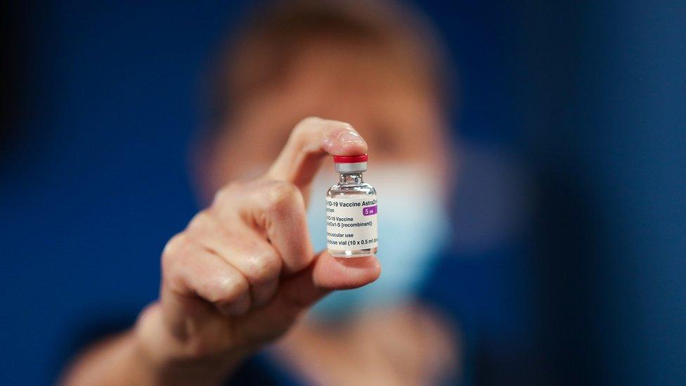 Nurse holding vaccine