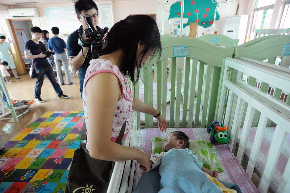 Jenna Cook visits the orphanage where she stayed in 1992