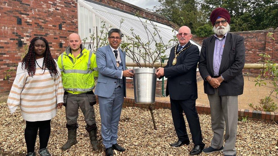 Sandwell mayor Bill Gavan and councillors stand to receive the award