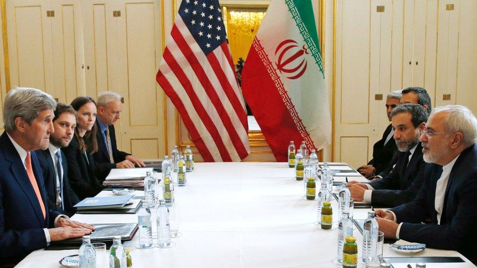 US Secretary of State John Kerry and Iranian Foreign Minister Javad Zarif, with other US and Iranian officials, meeting in Austria on 16 January 2016. The day the International Economic Energy Agency verified whether Iran had met all conditions under the nuclear deal.