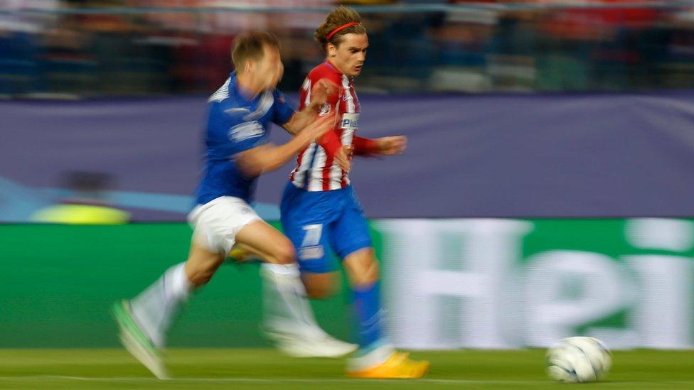 The referee gave Atletico a penalty after Leicester's Marc Albrighton (left) fouled Antoine Griezmann