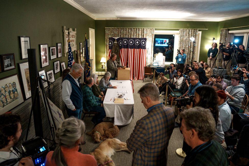 Six registered voters cast their vote on 5 November 2024 in Dixville Notch, New Hampshire. Americans cast their ballots on Tuesday in the presidential race between Republican nominee former President Donald Trump and Democratic nominee Vice-President Kamala Harris, as well as multiple state elections that will determine the balance of power in Congress. (Photo by John Tully/Getty Images)