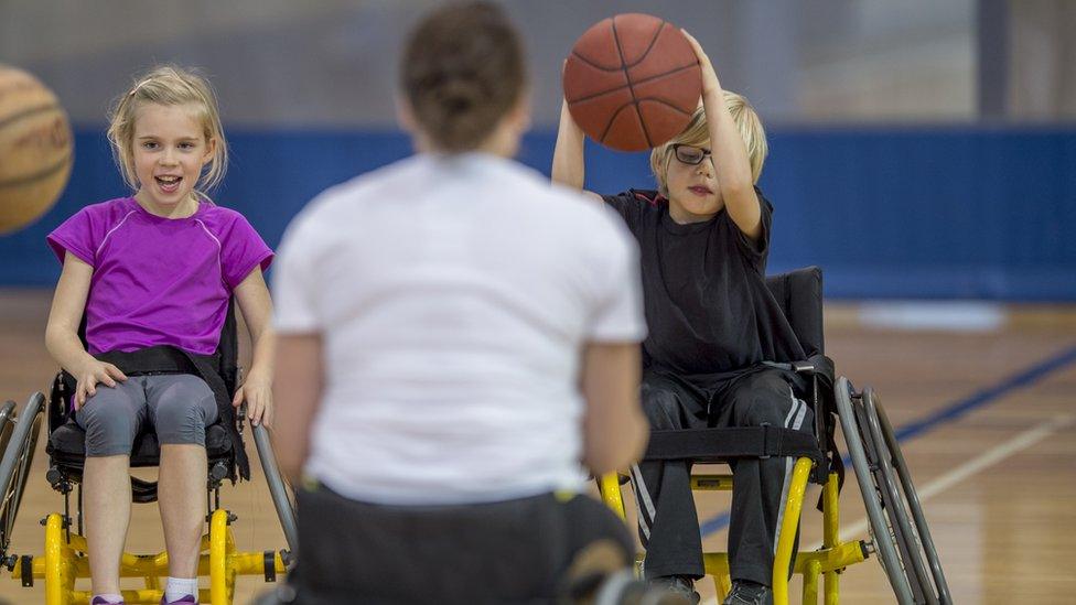 children-playing-wheelchair-basketball.