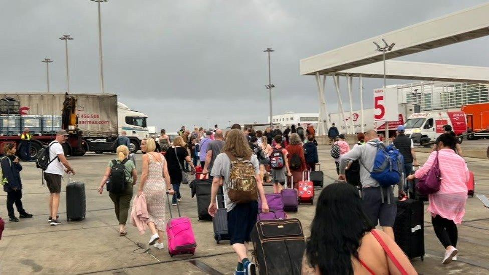 Passengers at ferry terminal