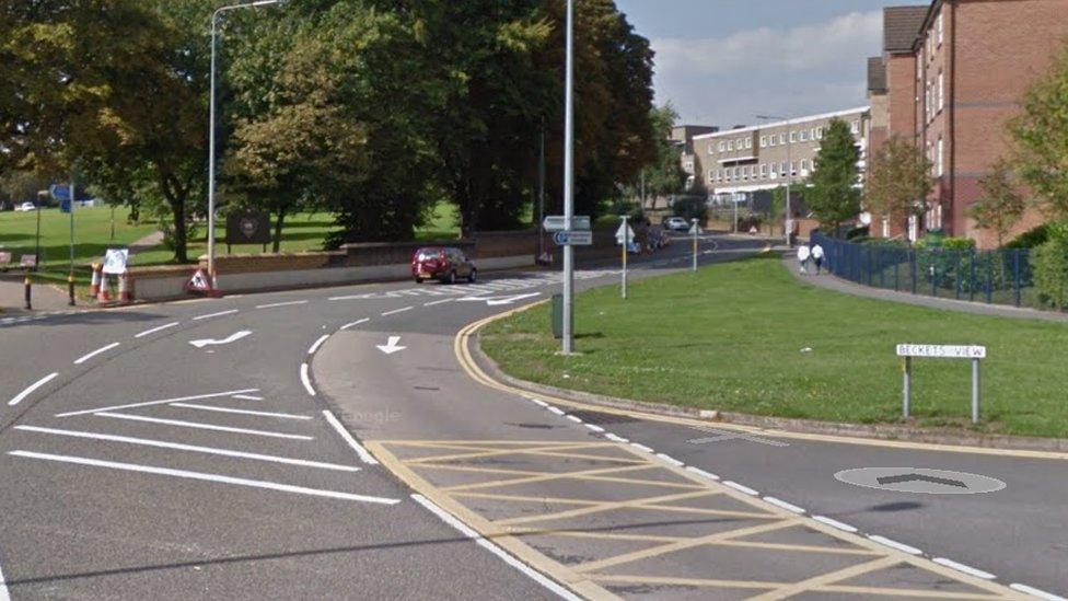 Road junction with park in the background