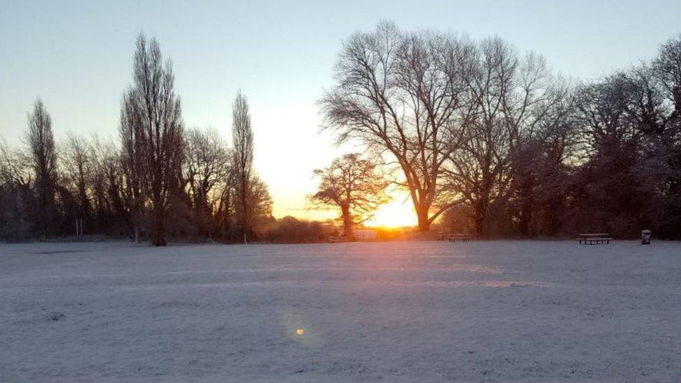 Sunrise over snowy field