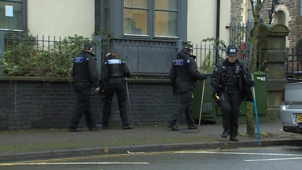 Police searching High Street, Swansea, following an incident on 23 December