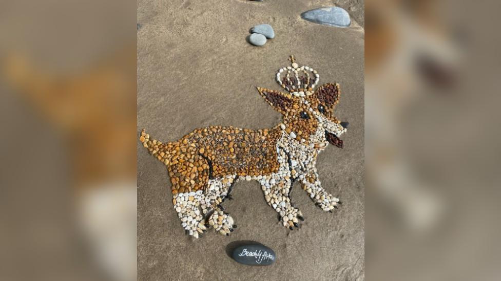 A photo of the pebble corgi on Sandymere beach in Devon