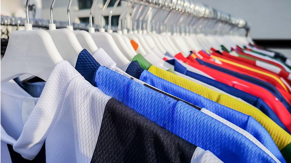 Football shirts in a shop