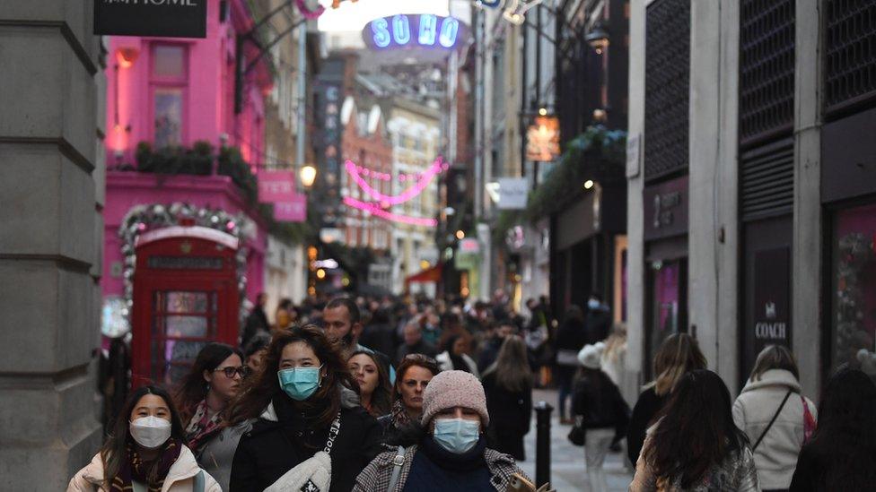 Shoppers make their way along Carnaby Street in London, Britain,