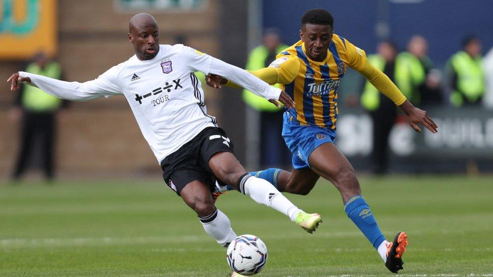 Tyrese Fornah of Shrewsbury Town and Sone Aluko of Ipswich Town