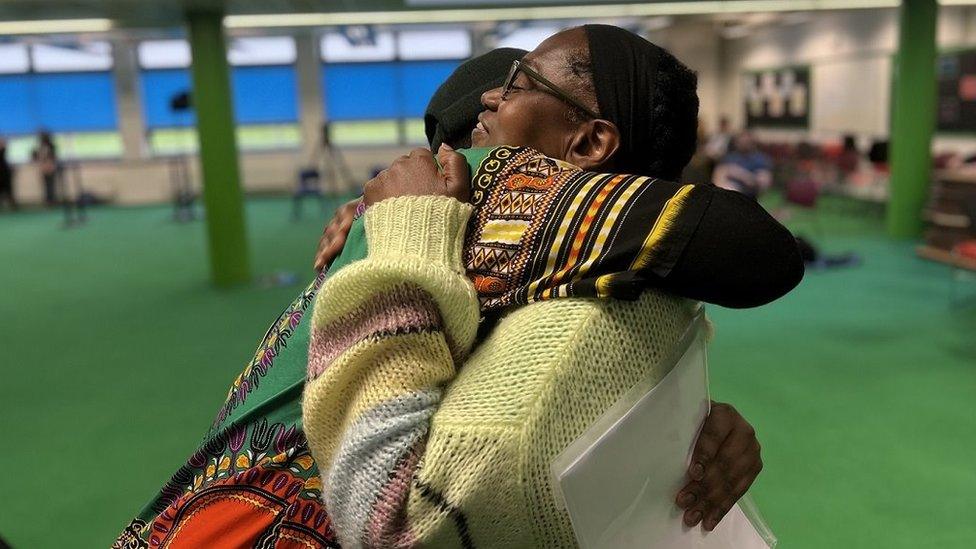 Two women hug each other at the local election count in Brislington Bristol as the Green Party took control of the city council