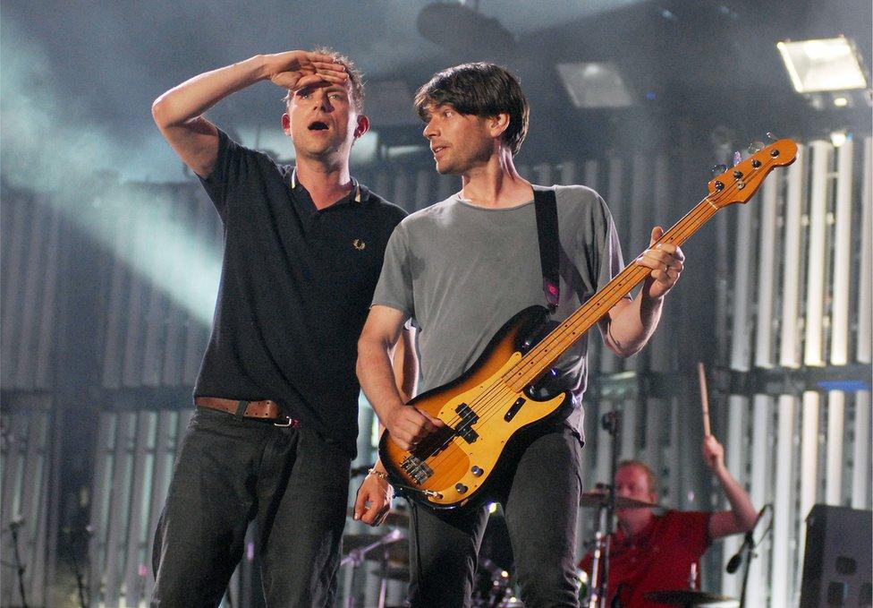 Damon Albarn and Alex James from Blur perform onstage