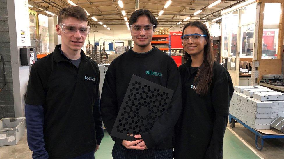 Luke Roberts, Robbie Denning and Maiya Roberts inside the Malmesbury factory