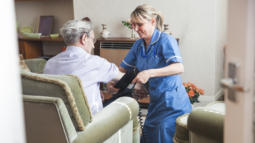 A woman with a social care worker