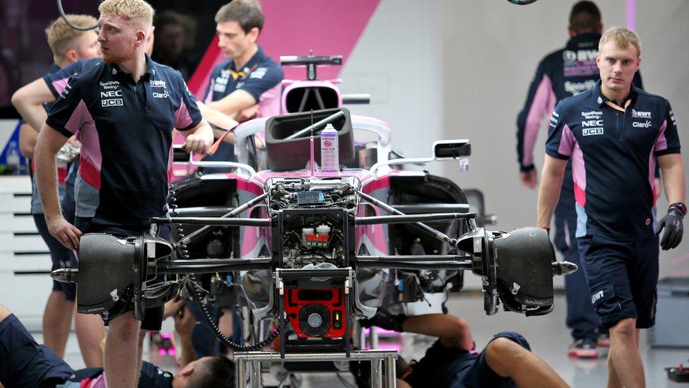 An F1 team working on a car