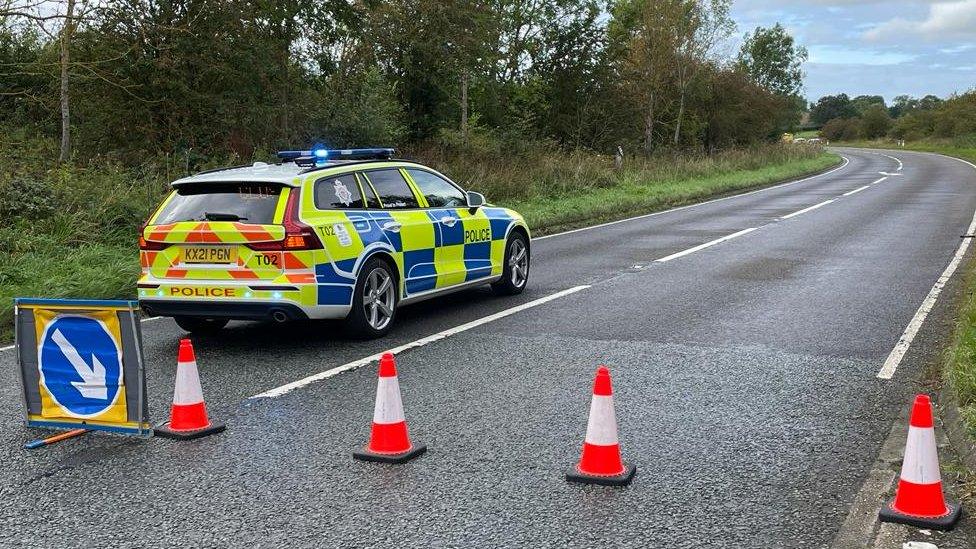 Police car closing the A696