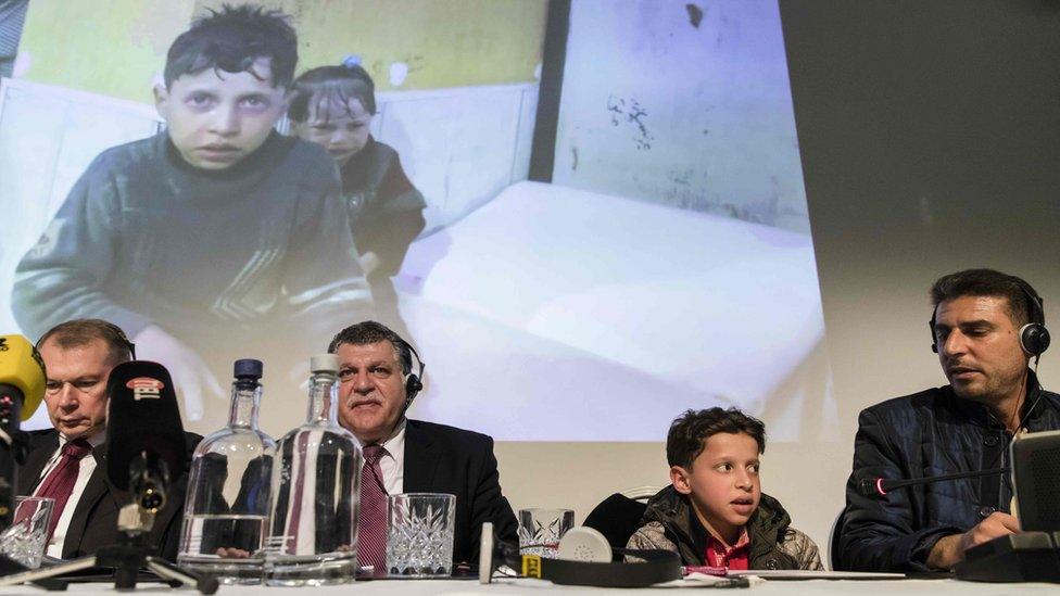 Russian officials at a press conference, alongside a boy pictured in the aftermath of the attack