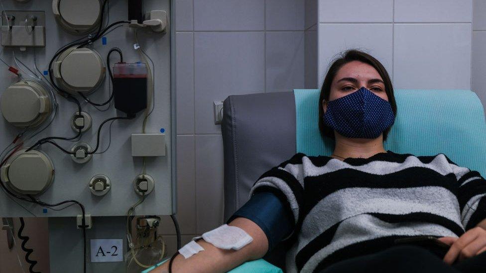 Kristina, (21years old) who recovered from COVID -19 donates her plasma via plasmapheresis method at the Regional Center of Blood Donation and Blood Treatment on November 10, 2020 in Krakow, Poland.