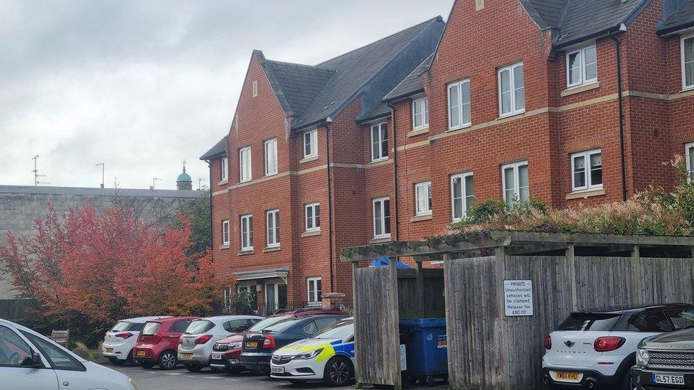 A police car outside the assisted living complex on Wednesday