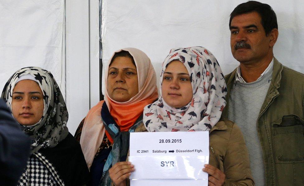 Migrants are registered as they arrive at Freilassing, near the German border on 28 September