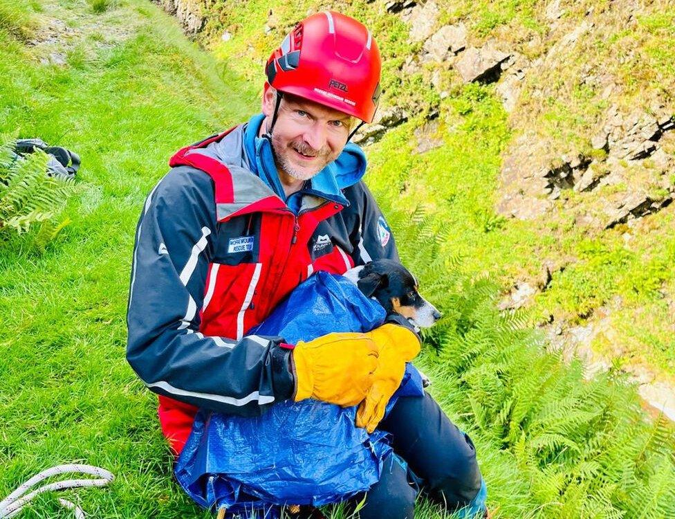 rescue team member with dog