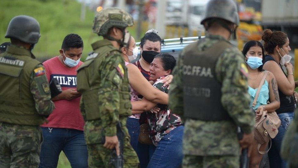 Relatives of inmates await news after the acts of violence experienced inside the Guayaquil prison, in Guayaquil, Ecuador, 23 February 2021.