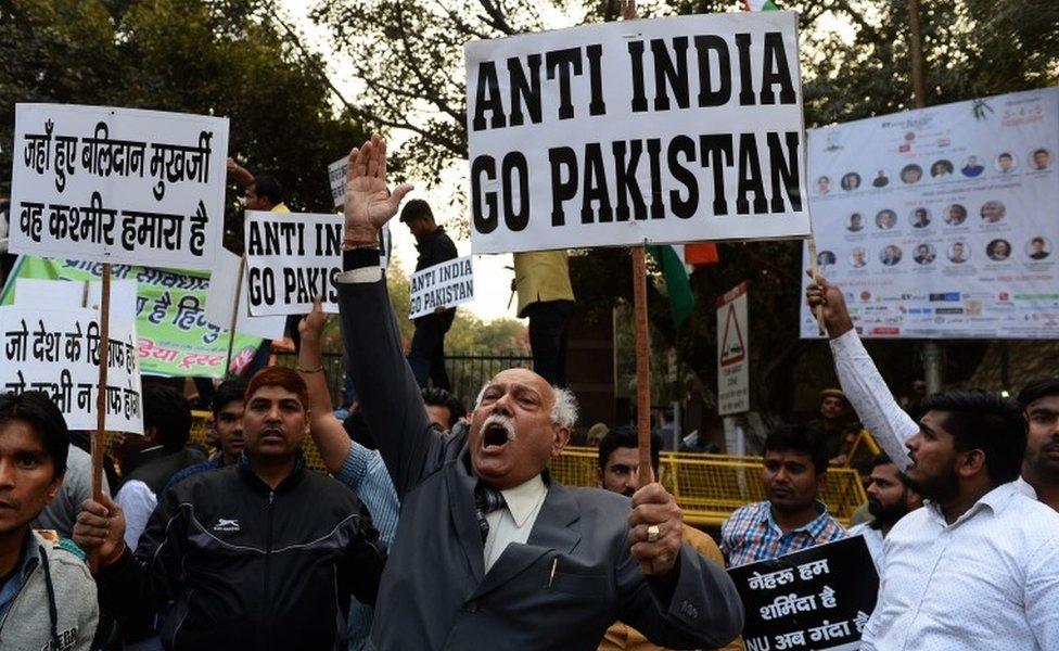 A file picture taken on February 17, 2016 shows Indian activists shouting slogans against Jawaharlal Nehru University (JNU) and the late Kashmiri separatist Mohammed Afzal Guru at a protest outside the university in New Delhi.